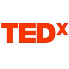 The logo for Tedx which says "TEDx" in red bold lettering o a white background