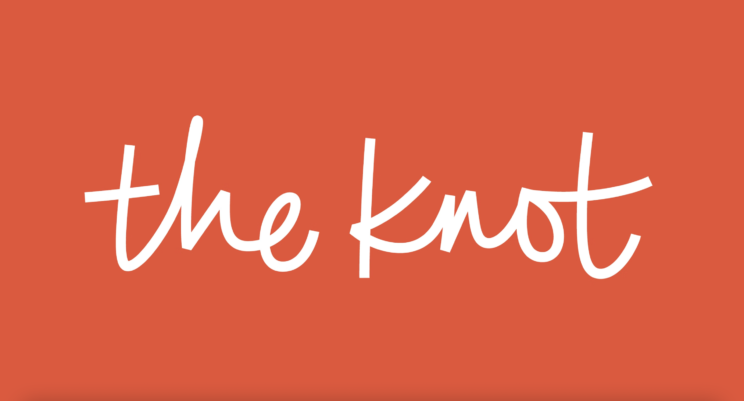 Logo for The Knot with white script on an orange background