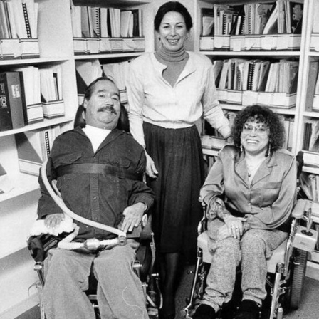A black and white photo of Ed Roberts, Joan Leon, and Judy Heumann