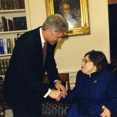 IMG_8394 Judy Heumann and Bill Clinton shaking hands